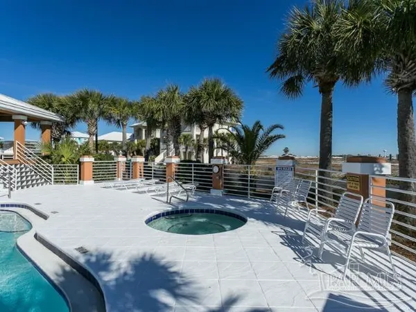 a swimming pool with outdoor seating and yard