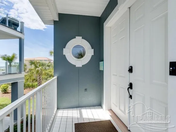 a view of entryway with wooden floor