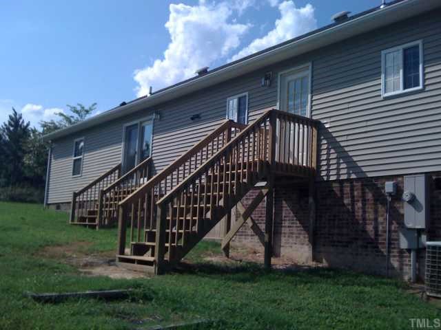 2616 Ellis Chapel Road Bahama, NC 27503 - Photo 2 of 11 a view of a house with a yard