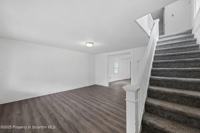 a view of entryway with wooden floor