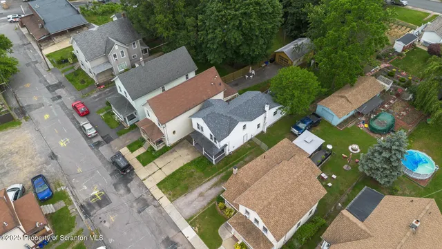 an aerial view of a house with a garden