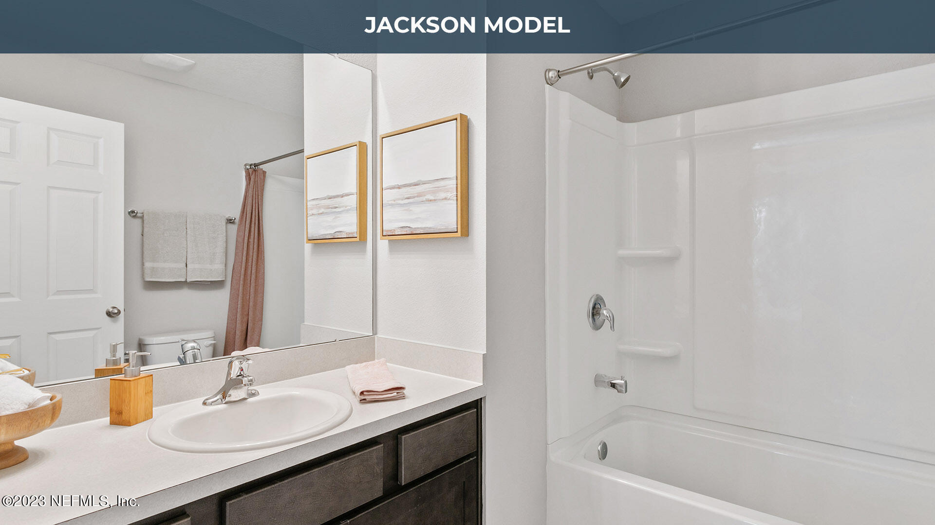 8357 Retrograde Road Jacksonville, FL 32256 - Photo 13 of 34 a bathroom with a sink a mirror and a bathtub