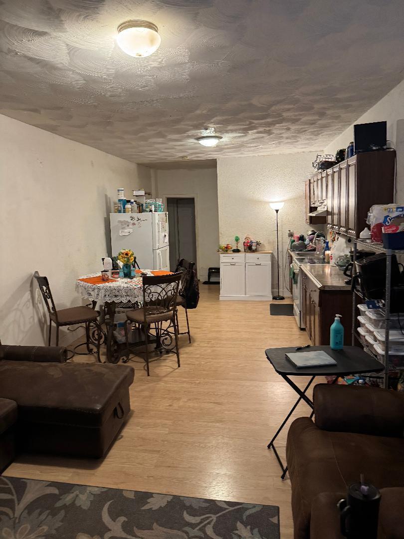511 Texas Court Fort Pierce, FL 34950 - Photo 2 of 15 a living room with furniture and a flat screen tv