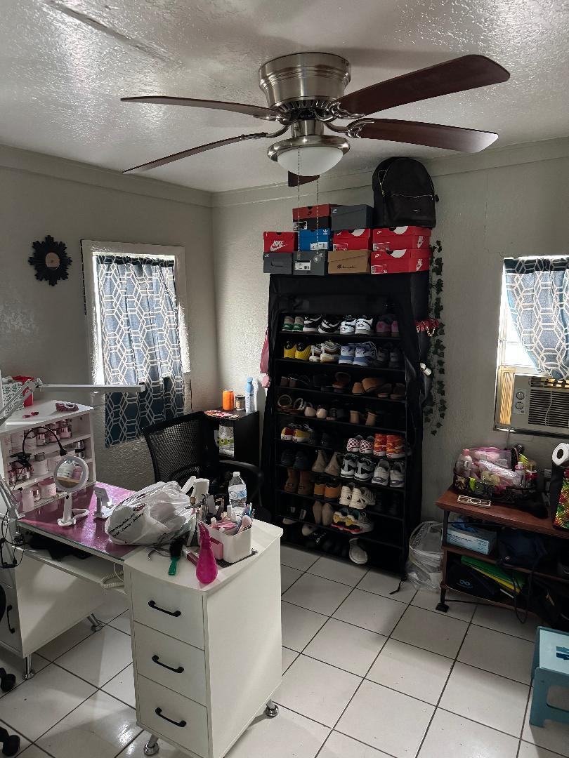 511 Texas Court Fort Pierce, FL 34950 - Photo 8 of 15 a living room with lots of furniture and a fireplace