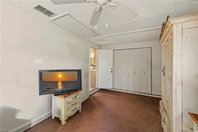 a bathroom with a toilet a sink and a mirror
