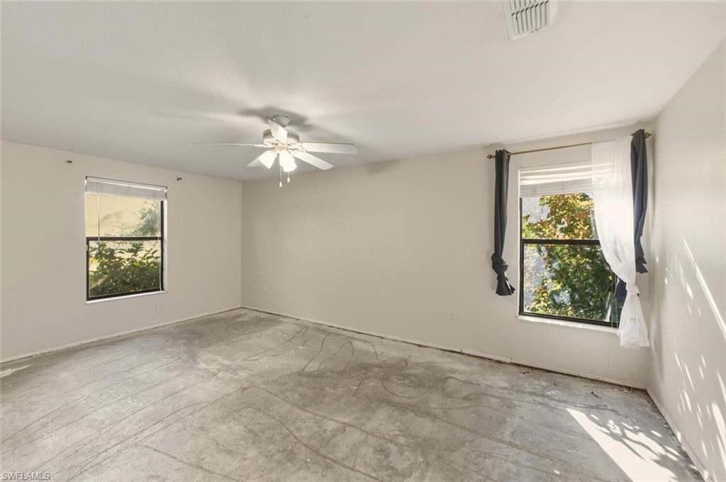 2747 47th Street Southwest Naples, FL 34116 - Photo 16 of 21 an empty room with windows and closet