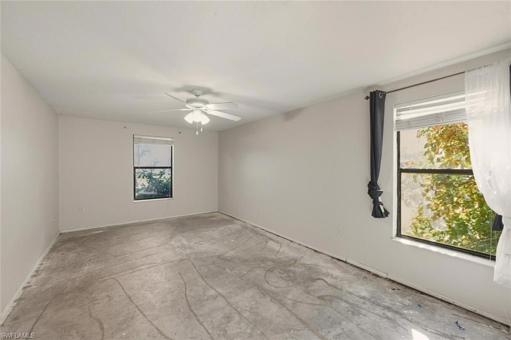 2747 47th Street Southwest Naples, FL 34116 - Photo 17 of 21 an empty room with windows and closet