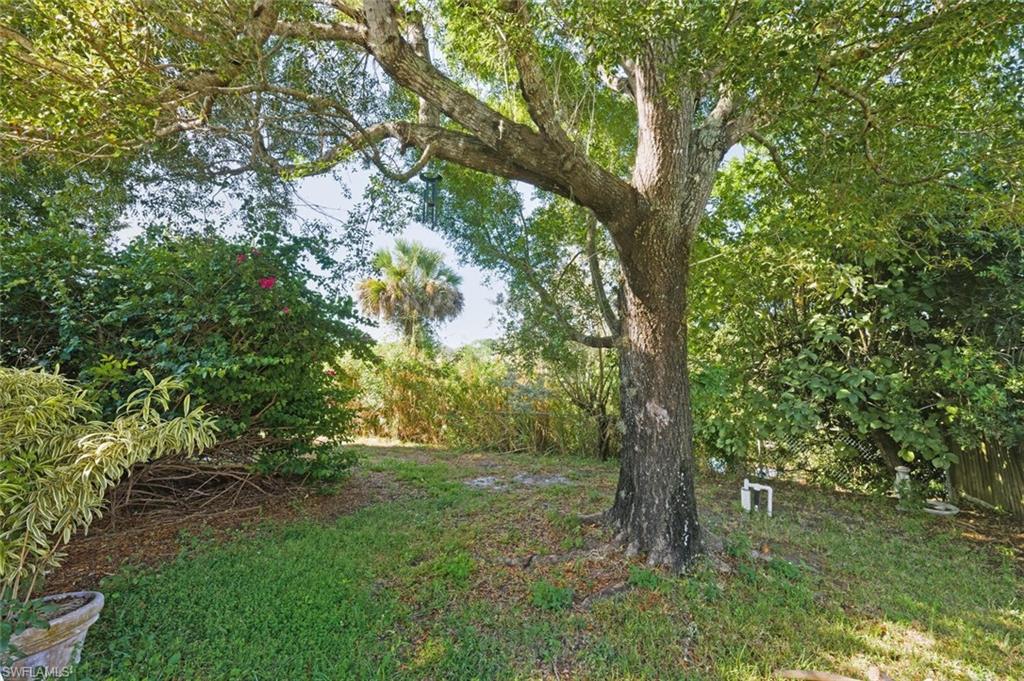 2747 47th Street Southwest Naples, FL 34116 - Photo 20 of 21 a big yard with lots of green space and house