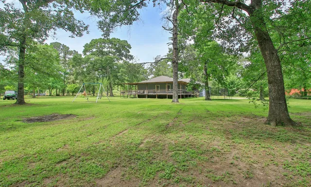 a view of a house with a big yard
