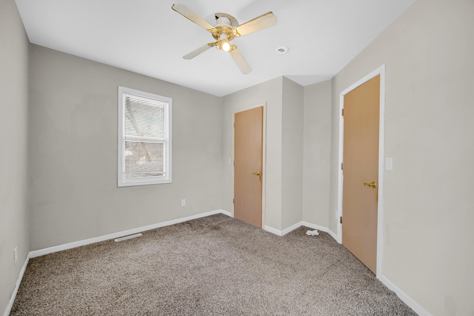 6415 West 146th Place Crown Point, IN 46307 - Photo 12 of 23 a view of a room with a ceiling fan and a window
