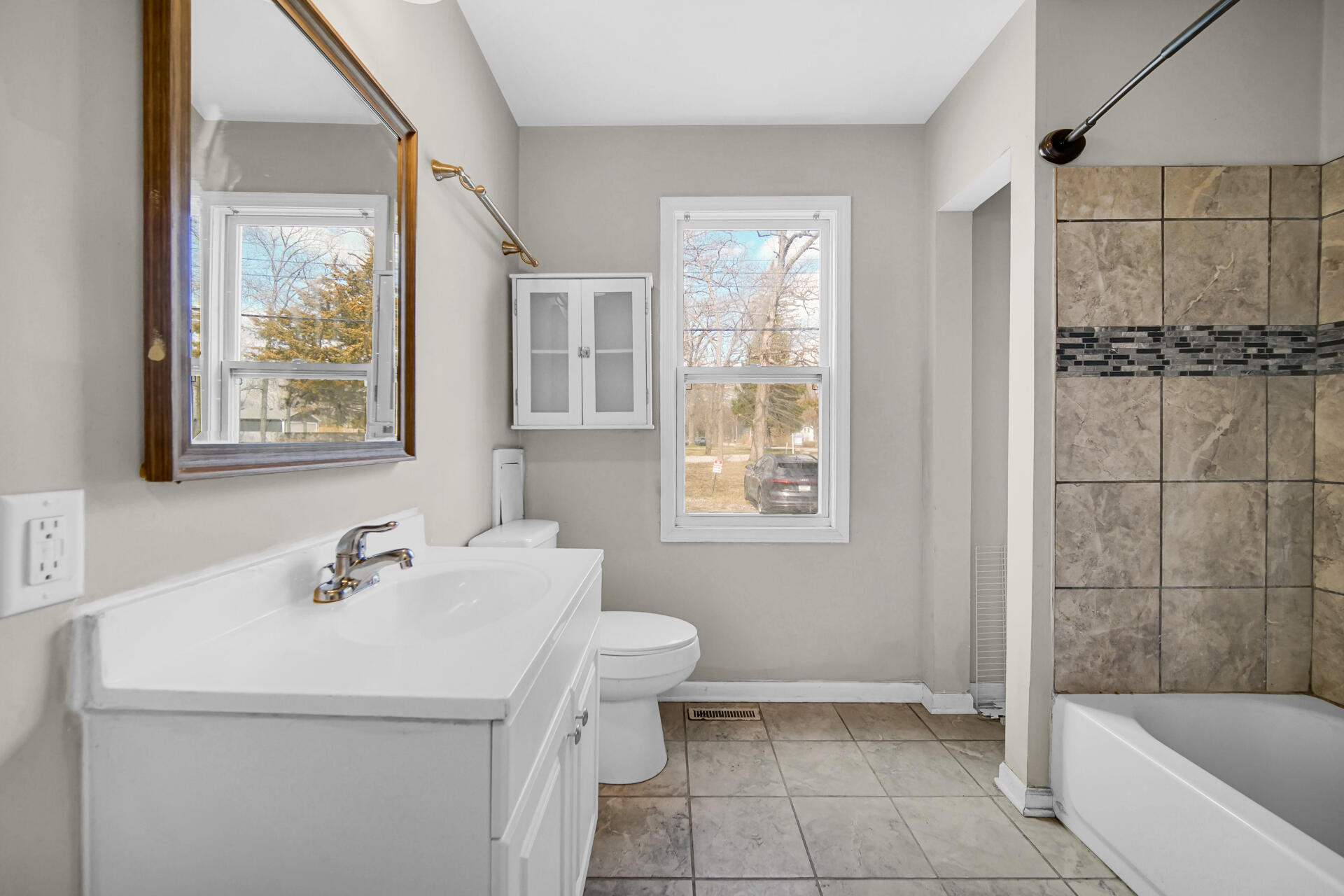 6415 West 146th Place Crown Point, IN 46307 - Photo 13 of 23 a bathroom with a sink toilet and shower