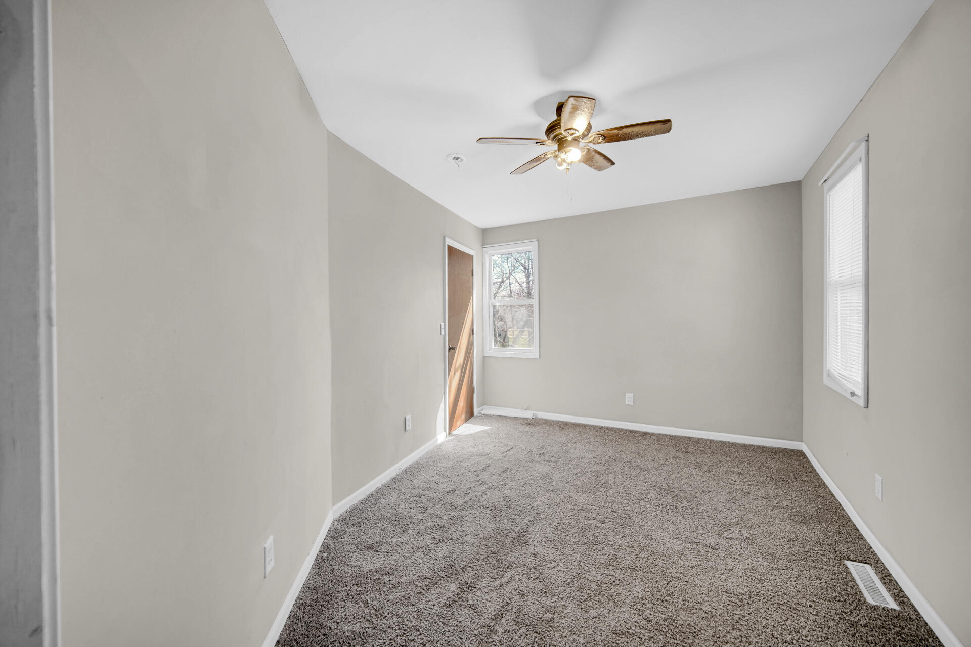 6415 West 146th Place Crown Point, IN 46307 - Photo 16 of 23 a view of an empty room with a window