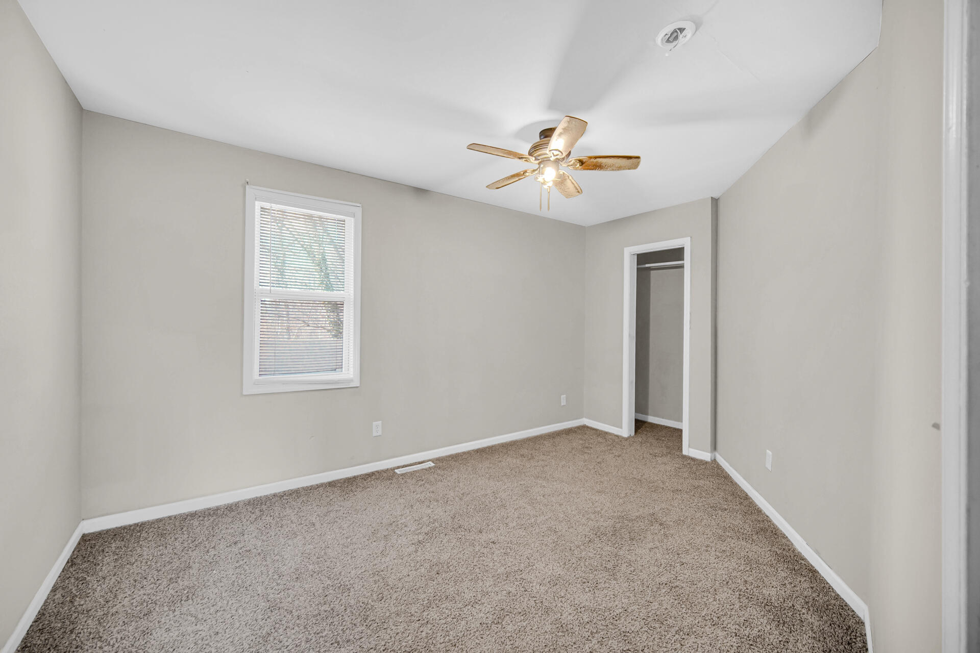 6415 West 146th Place Crown Point, IN 46307 - Photo 17 of 23 an empty room with windows and fan