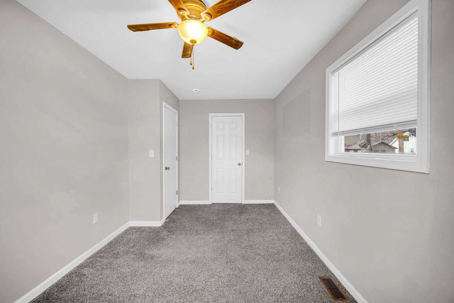 6415 West 146th Place Crown Point, IN 46307 - Photo 18 of 23 an empty room with windows and fan