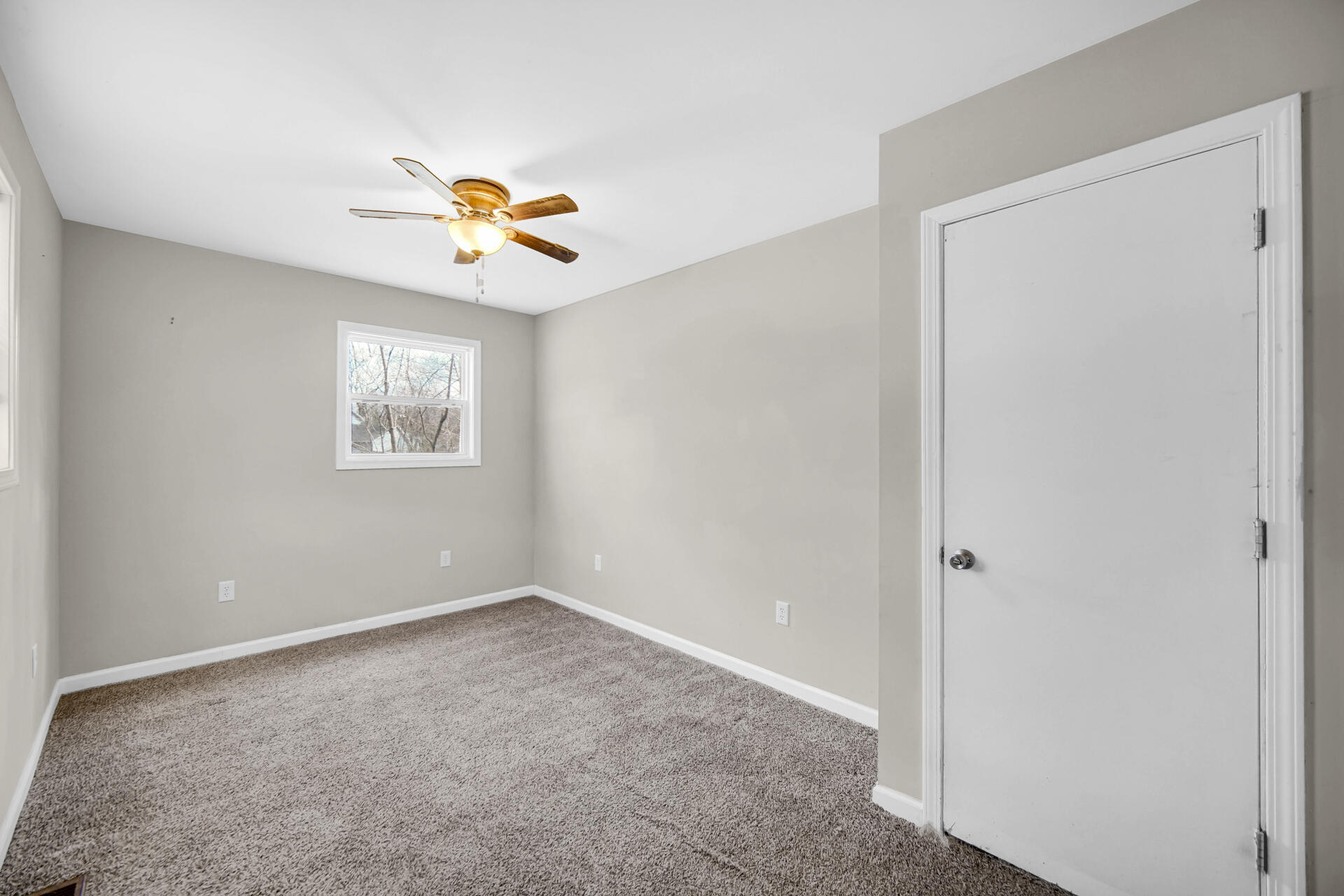 6415 West 146th Place Crown Point, IN 46307 - Photo 19 of 23 a view of a room with a ceiling fan and a window