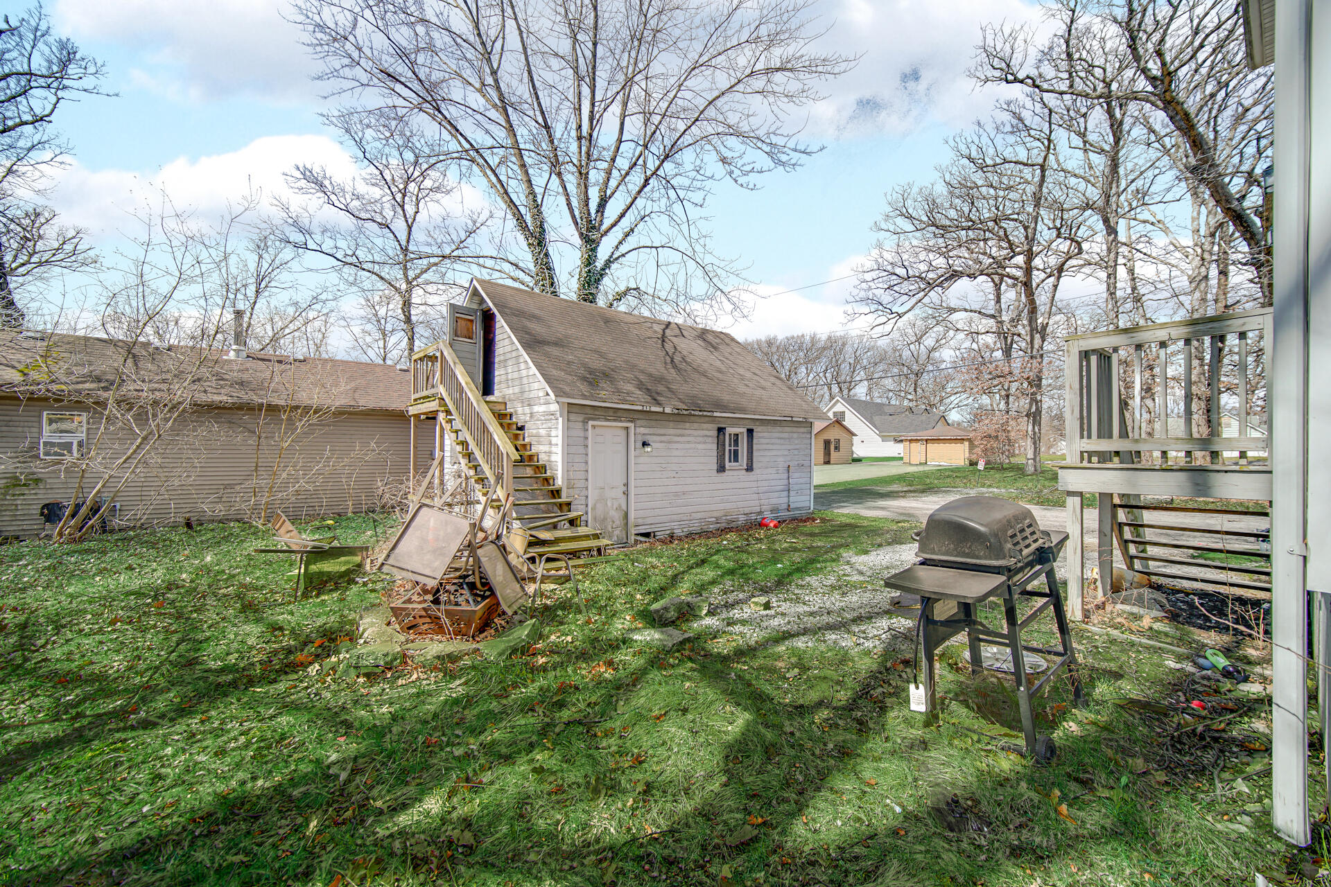6415 West 146th Place Crown Point, IN 46307 - Photo 22 of 23 a view of a chair and table in backyard of the house