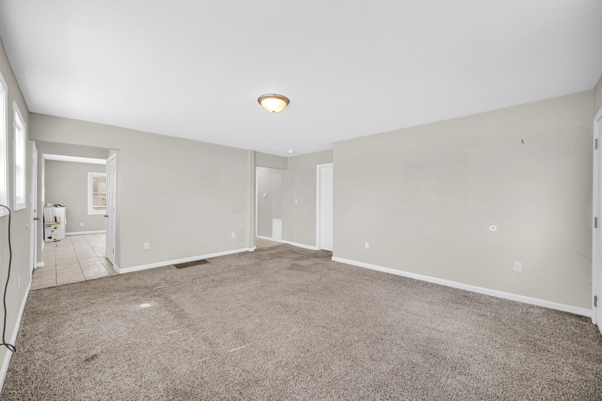 6415 West 146th Place Crown Point, IN 46307 - Photo 4 of 23 a view of an empty room and window