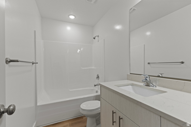 3410 South 1010th Street West Logan, UT 84321 - Photo 12 of 15 Full bath featuring washtub / shower combination, vanity, and light wood-style floors