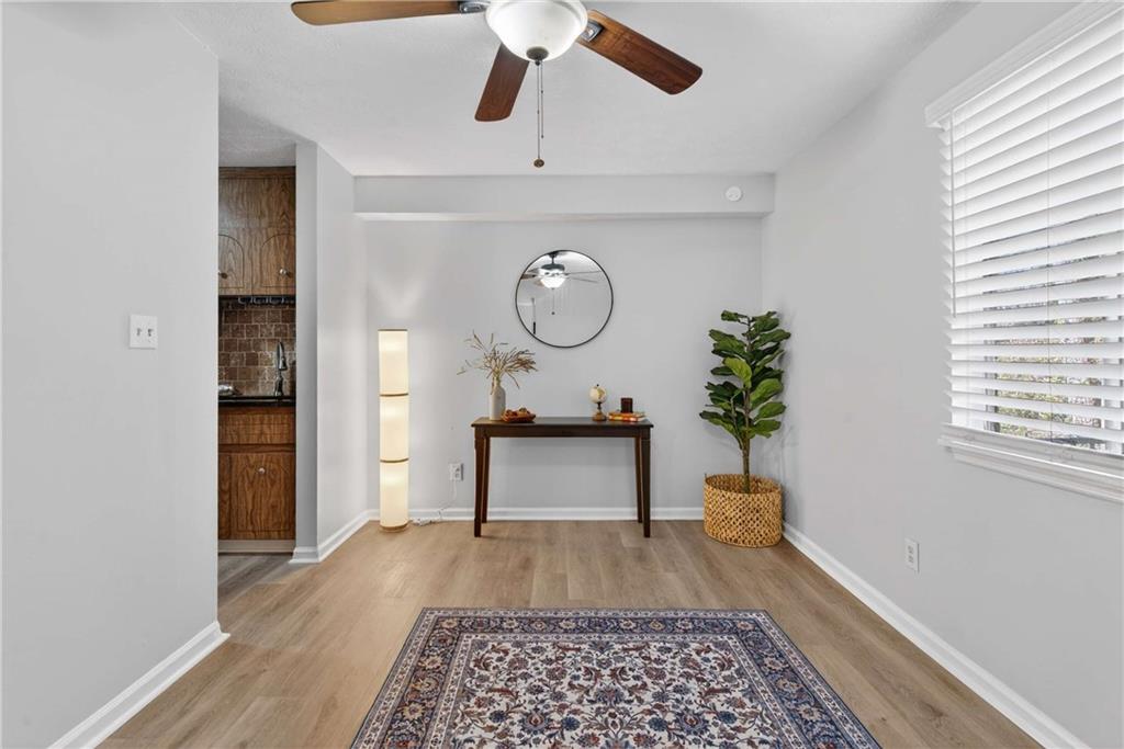 2396 Lawrenceville Highway, Unit G Decatur, GA 30033 - Photo 15 of 30 a living room with a bed furniture and a window