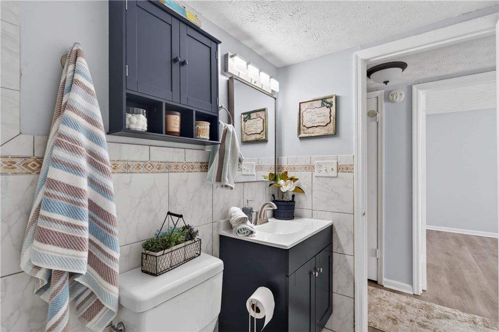 2396 Lawrenceville Highway, Unit G Decatur, GA 30033 - Photo 20 of 30 a bathroom with a sink and a mirror