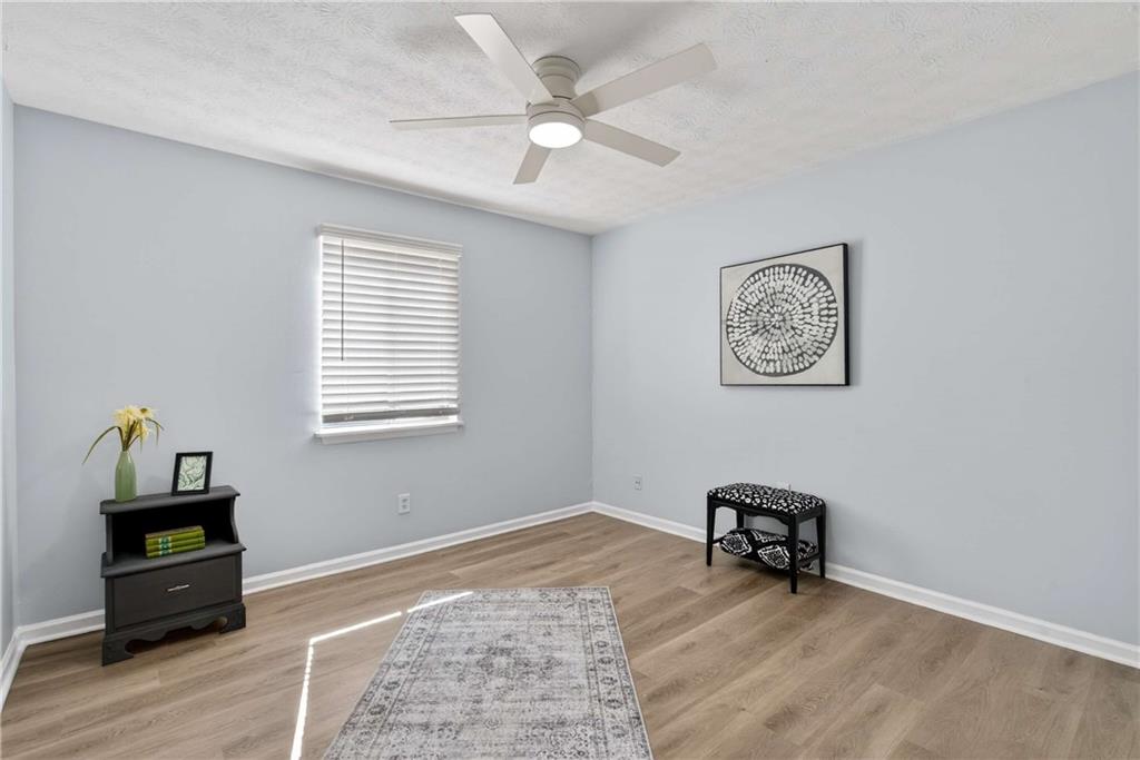 2396 Lawrenceville Highway, Unit G Decatur, GA 30033 - Photo 24 of 30 a room with furniture and wooden floor