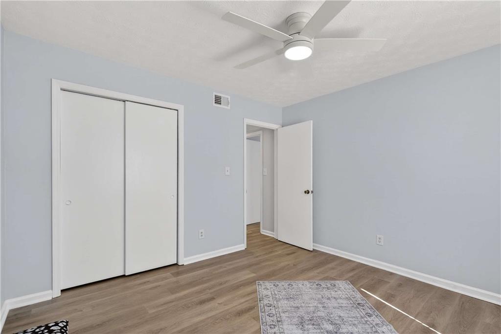 2396 Lawrenceville Highway, Unit G Decatur, GA 30033 - Photo 25 of 30 wooden floor in an empty room