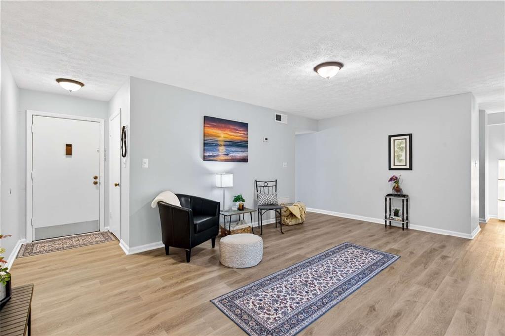 2396 Lawrenceville Highway, Unit G Decatur, GA 30033 - Photo 6 of 30 a living room with furniture and a rug