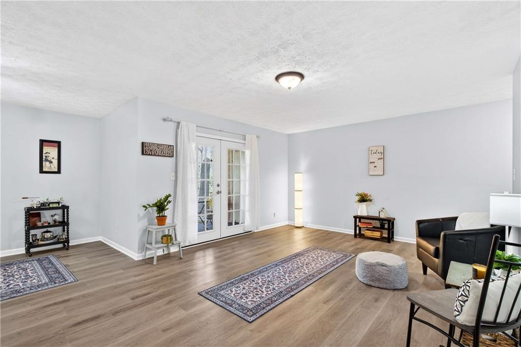 2396 Lawrenceville Highway, Unit G Decatur, GA 30033 - Photo 8 of 30 a living room with furniture and wooden floor