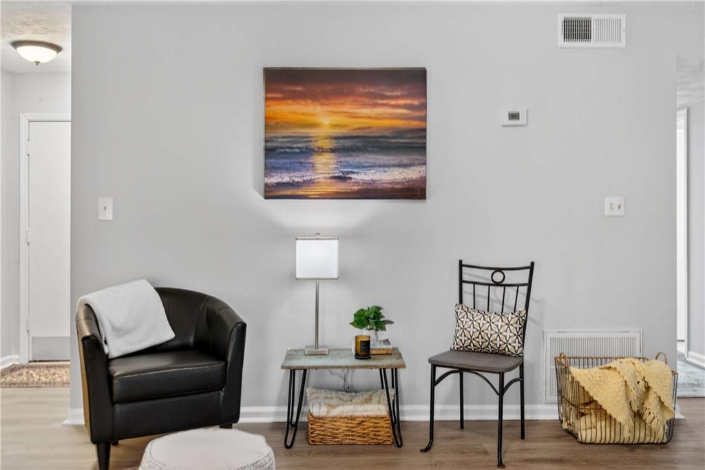 2396 Lawrenceville Highway, Unit G Decatur, GA 30033 - Photo 9 of 30 a living room with furniture and a lamp