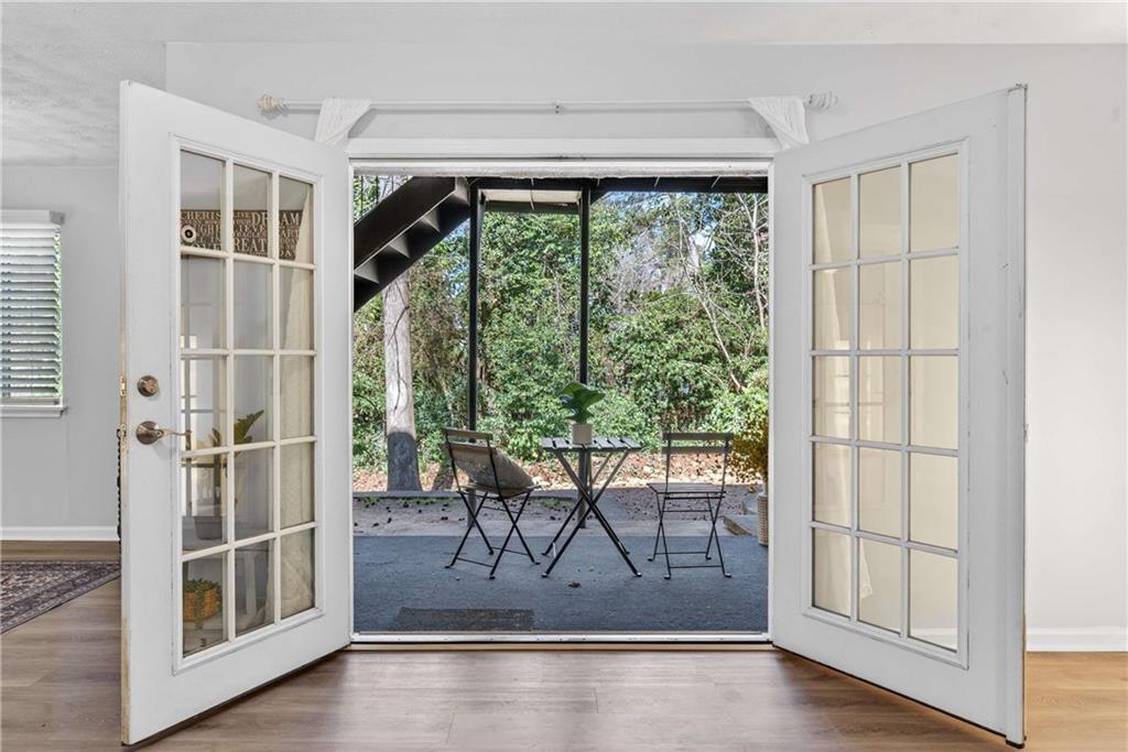 2396 Lawrenceville Highway, Unit G Decatur, GA 30033 - Photo 10 of 30 a view of a livingroom with wooden floor and a window