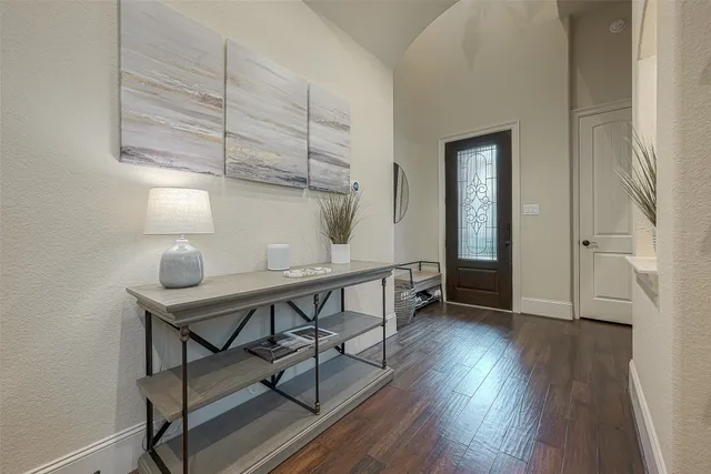 a view of a workspace with furniture and wooden floor