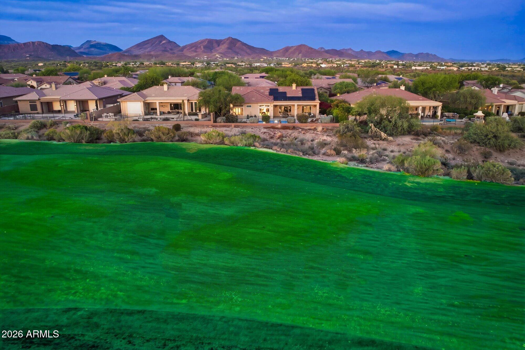 40322 North Hawk Ridge Trail Anthem, AZ 85086 - Photo 58 of 63 a view of a garden with a lake