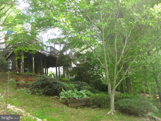 9400 Perglen Road Nottingham, MD 21236 - Photo 21 of 28 Rearview of Deck & Terraced Gardens