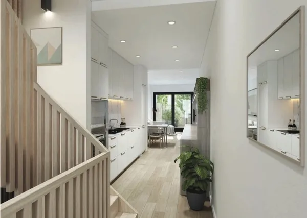 a living room with furniture and entryway
