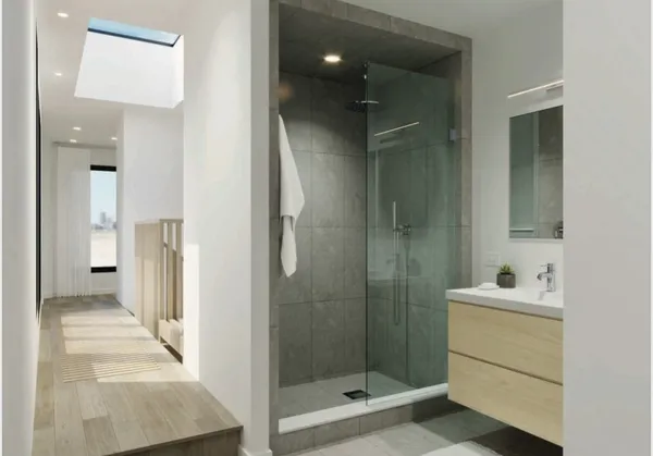 a bathroom with a shower sink and mirror