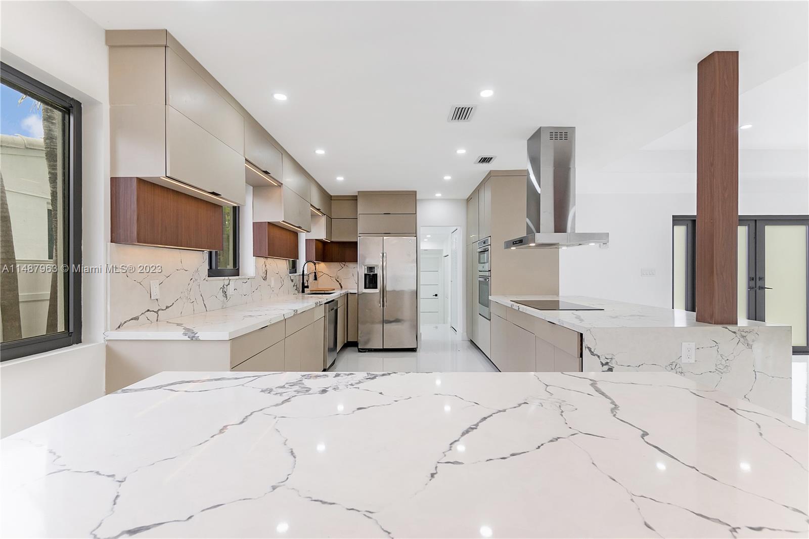 1200 Cleveland Road Miami Beach, FL 33141 - Photo 12 of 41 a large bedroom with a large bed and a large window