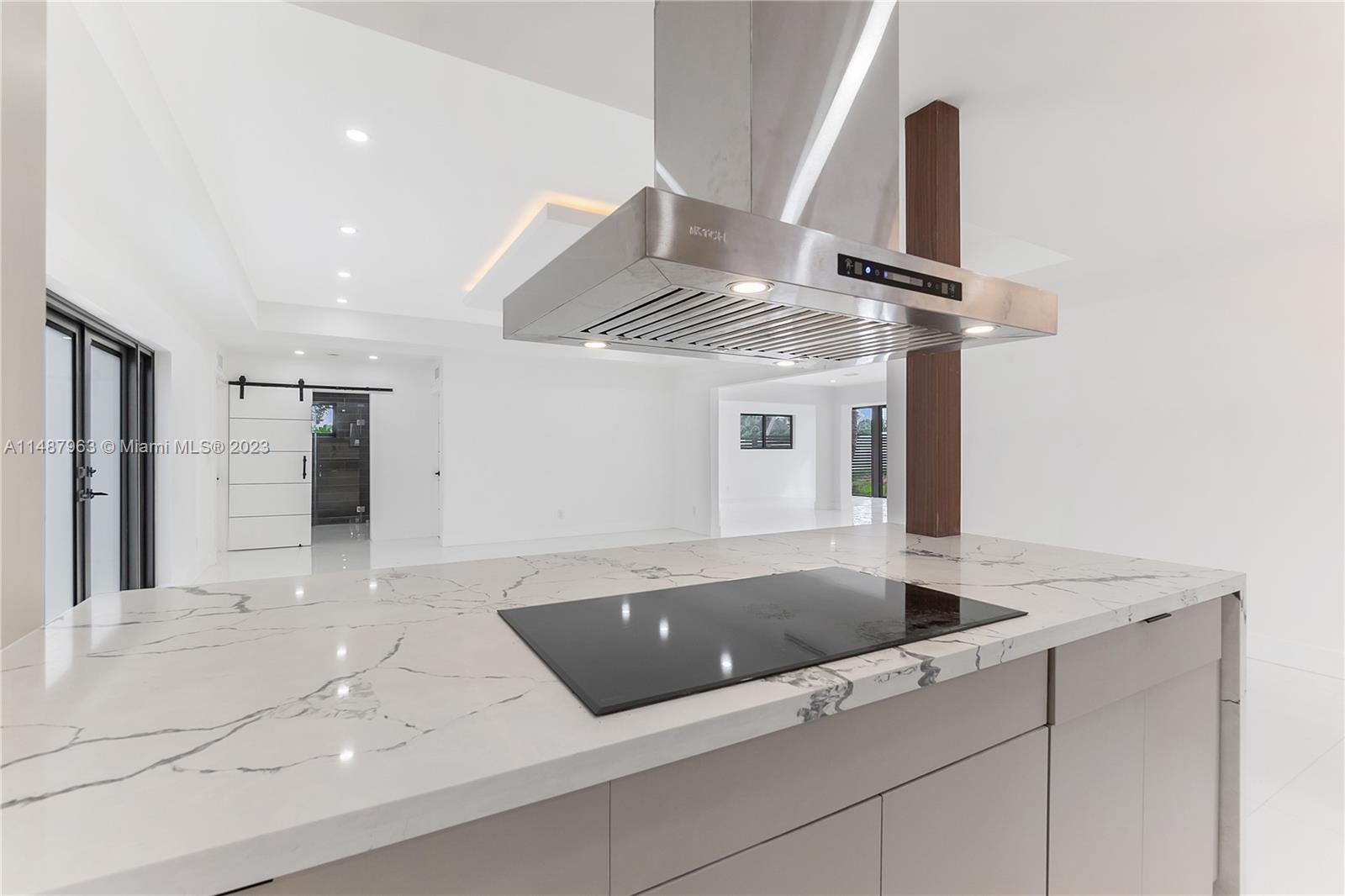 1200 Cleveland Road Miami Beach, FL 33141 - Photo 15 of 41 a kitchen with a sink and refrigerator