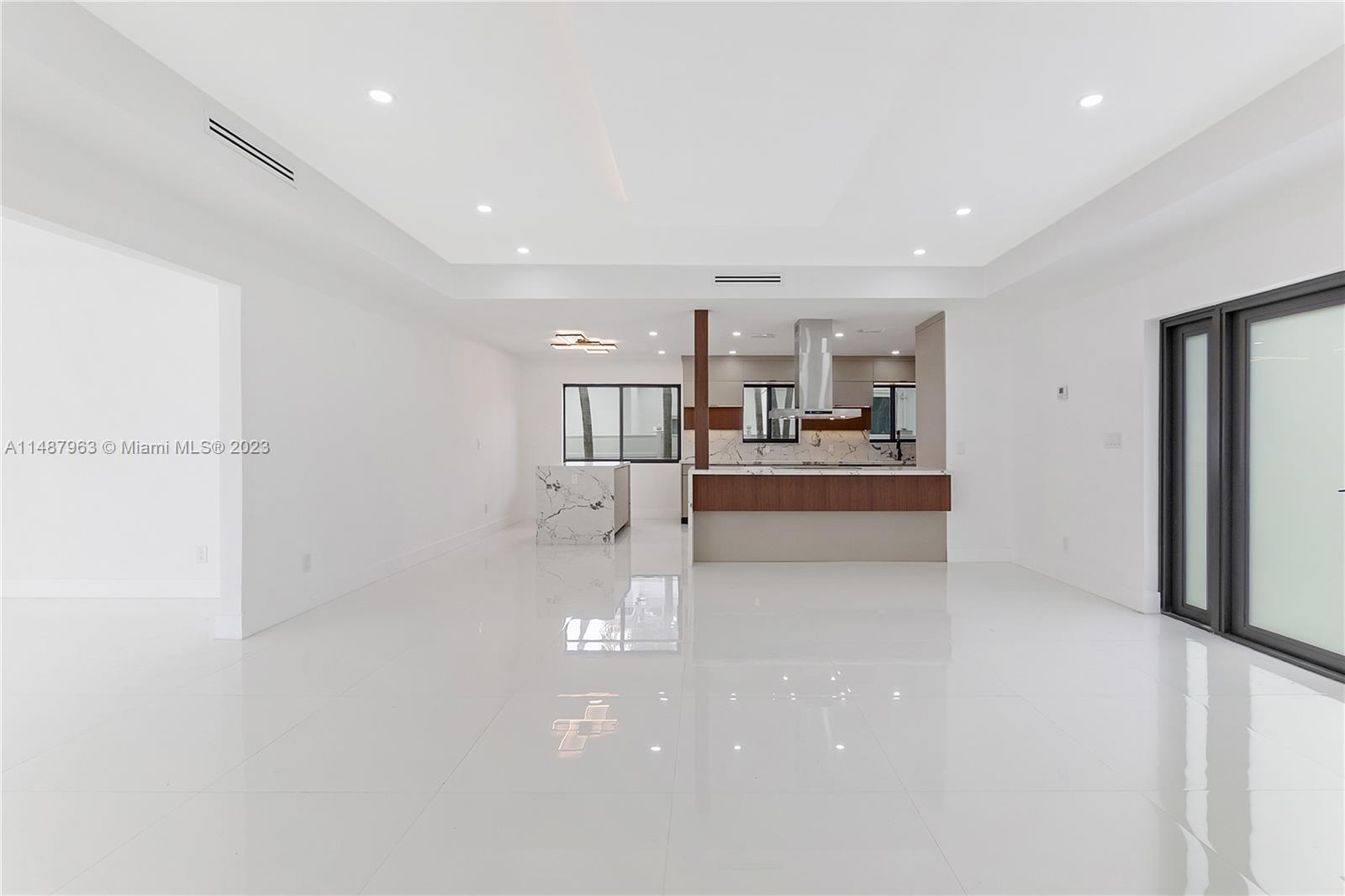 1200 Cleveland Road Miami Beach, FL 33141 - Photo 19 of 41 a kitchen with stainless steel appliances granite countertop a refrigerator and a stove top oven