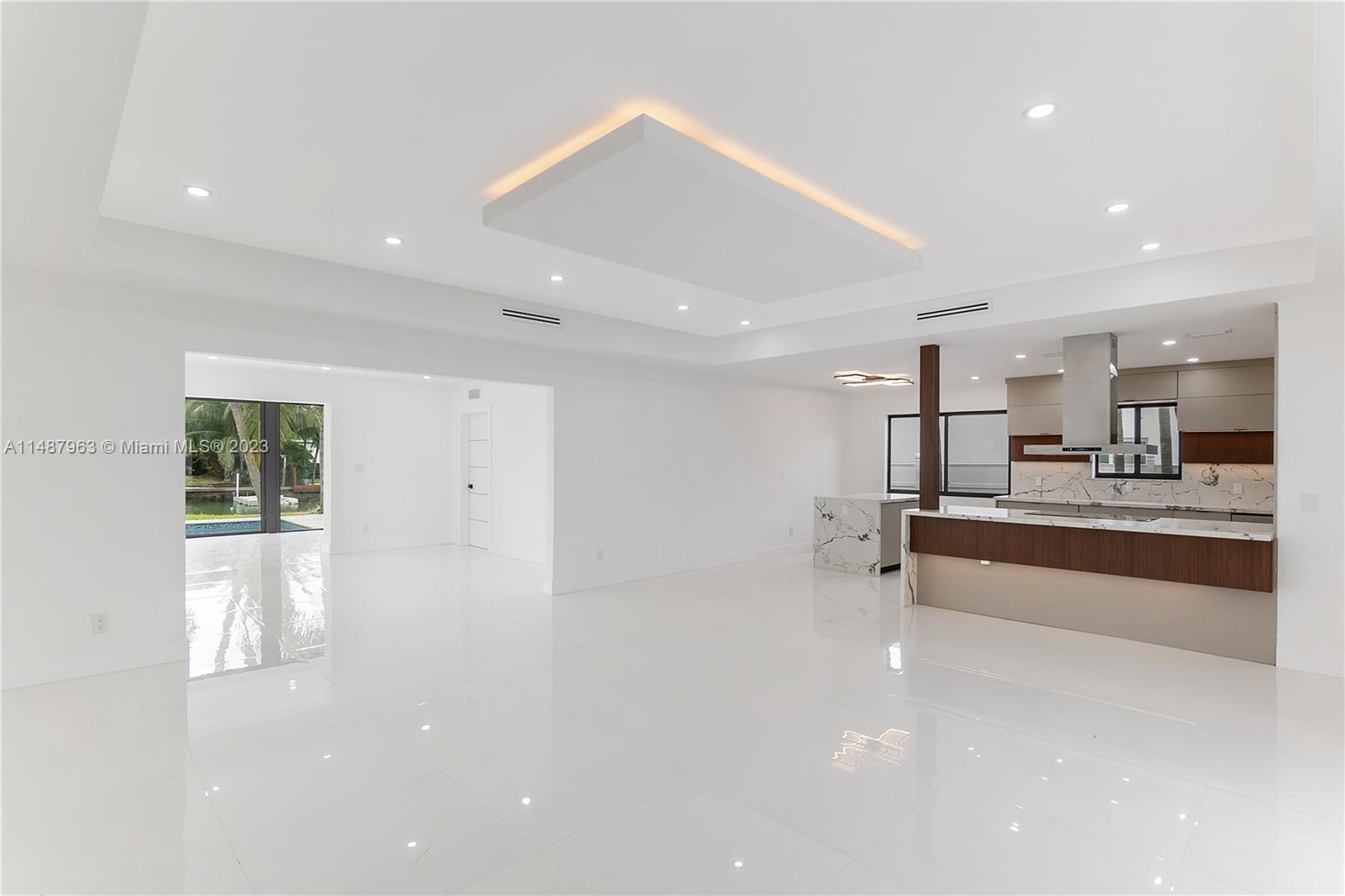 1200 Cleveland Road Miami Beach, FL 33141 - Photo 20 of 41 a large white kitchen with a sink stainless steel appliances and cabinets