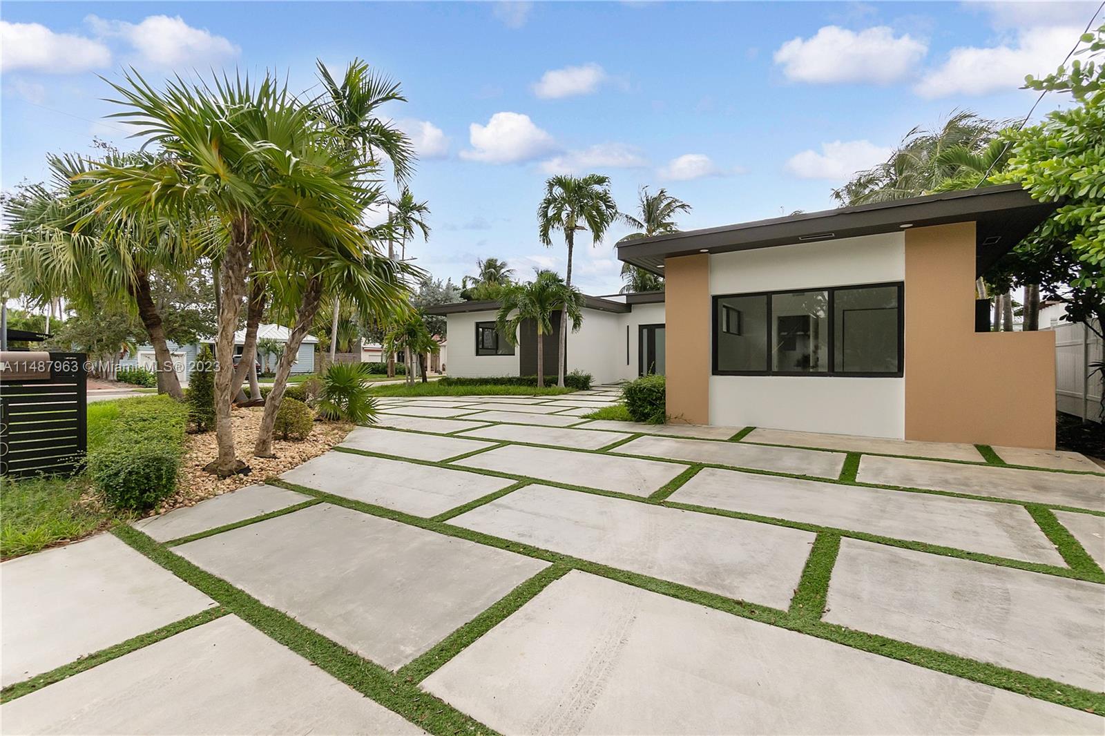 1200 Cleveland Road Miami Beach, FL 33141 - Photo 2 of 41 a view of a house with palm trees