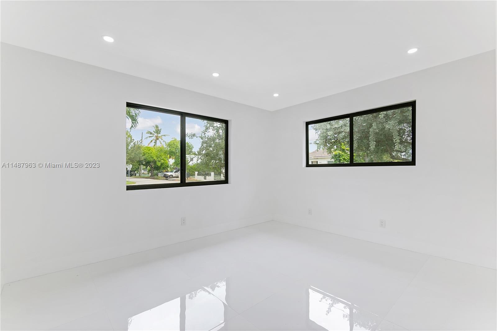 1200 Cleveland Road Miami Beach, FL 33141 - Photo 23 of 41 a view of hallway with window and a potted plant