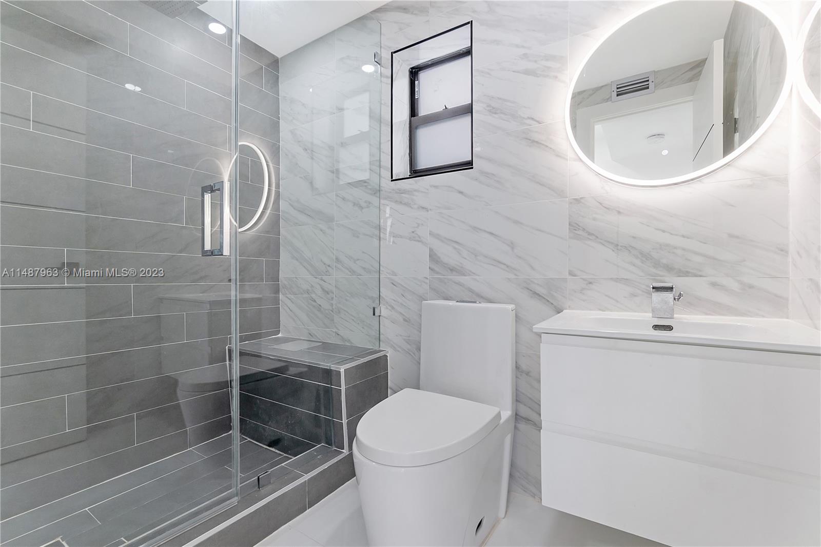 1200 Cleveland Road Miami Beach, FL 33141 - Photo 25 of 41 a bathroom with a toilet sink and shower