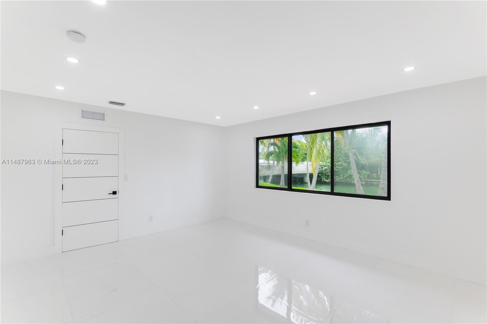 1200 Cleveland Road Miami Beach, FL 33141 - Photo 36 of 41 a view of an empty room with a window