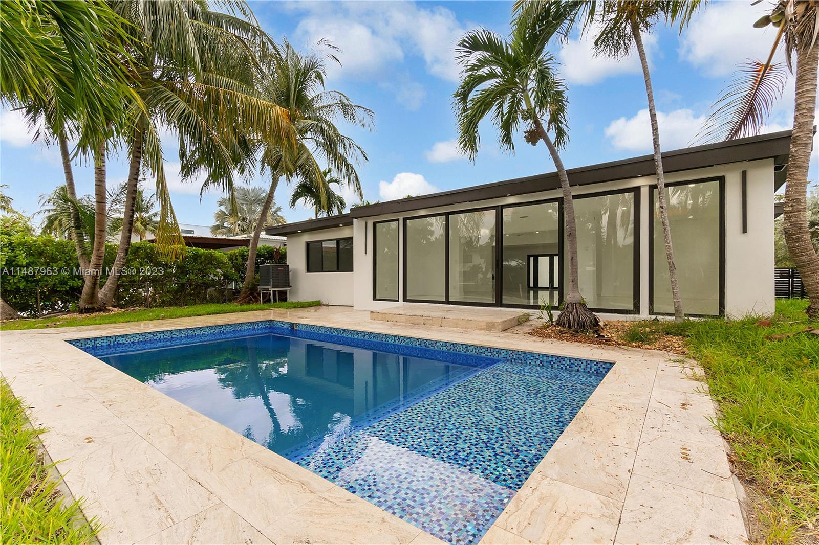 1200 Cleveland Road Miami Beach, FL 33141 - Photo 38 of 41 a view of swimming pool with palm trees