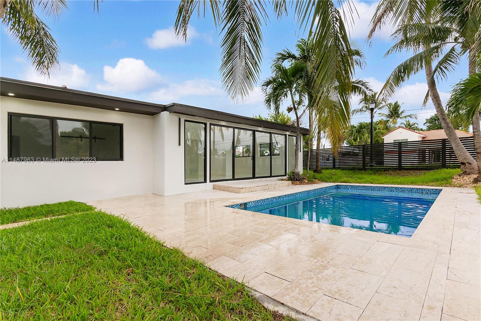 1200 Cleveland Road Miami Beach, FL 33141 - Photo 39 of 41 a view of swimming pool with palm trees