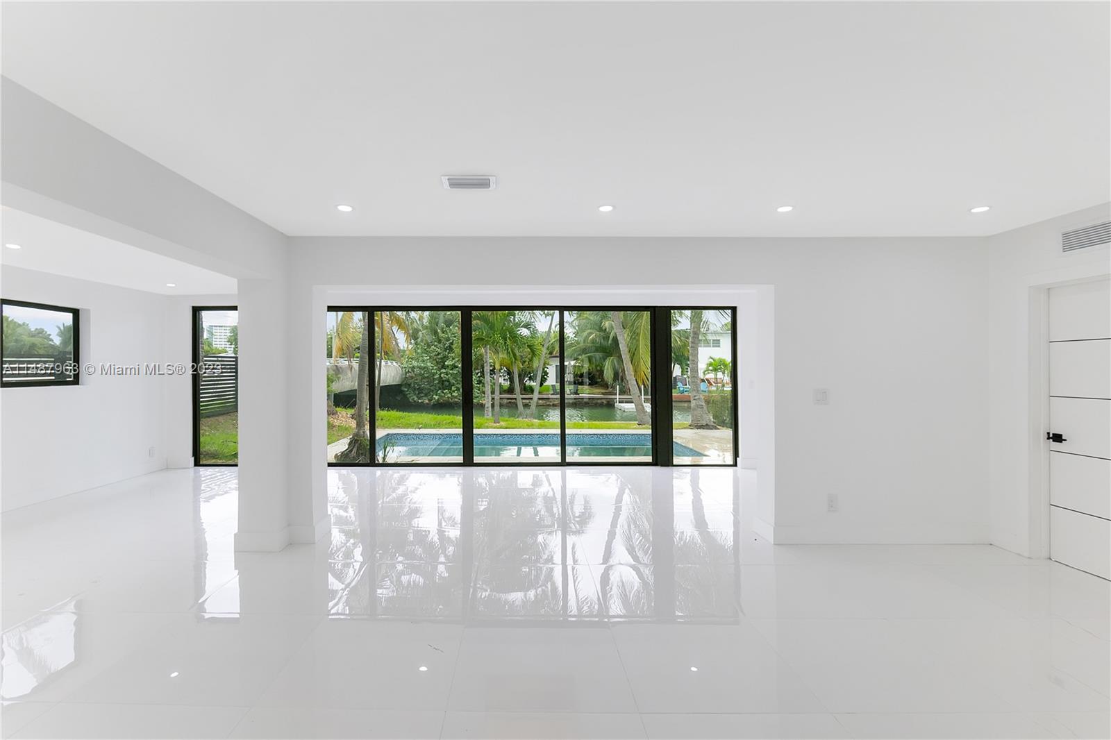 1200 Cleveland Road Miami Beach, FL 33141 - Photo 5 of 41 a view of an empty room with a window