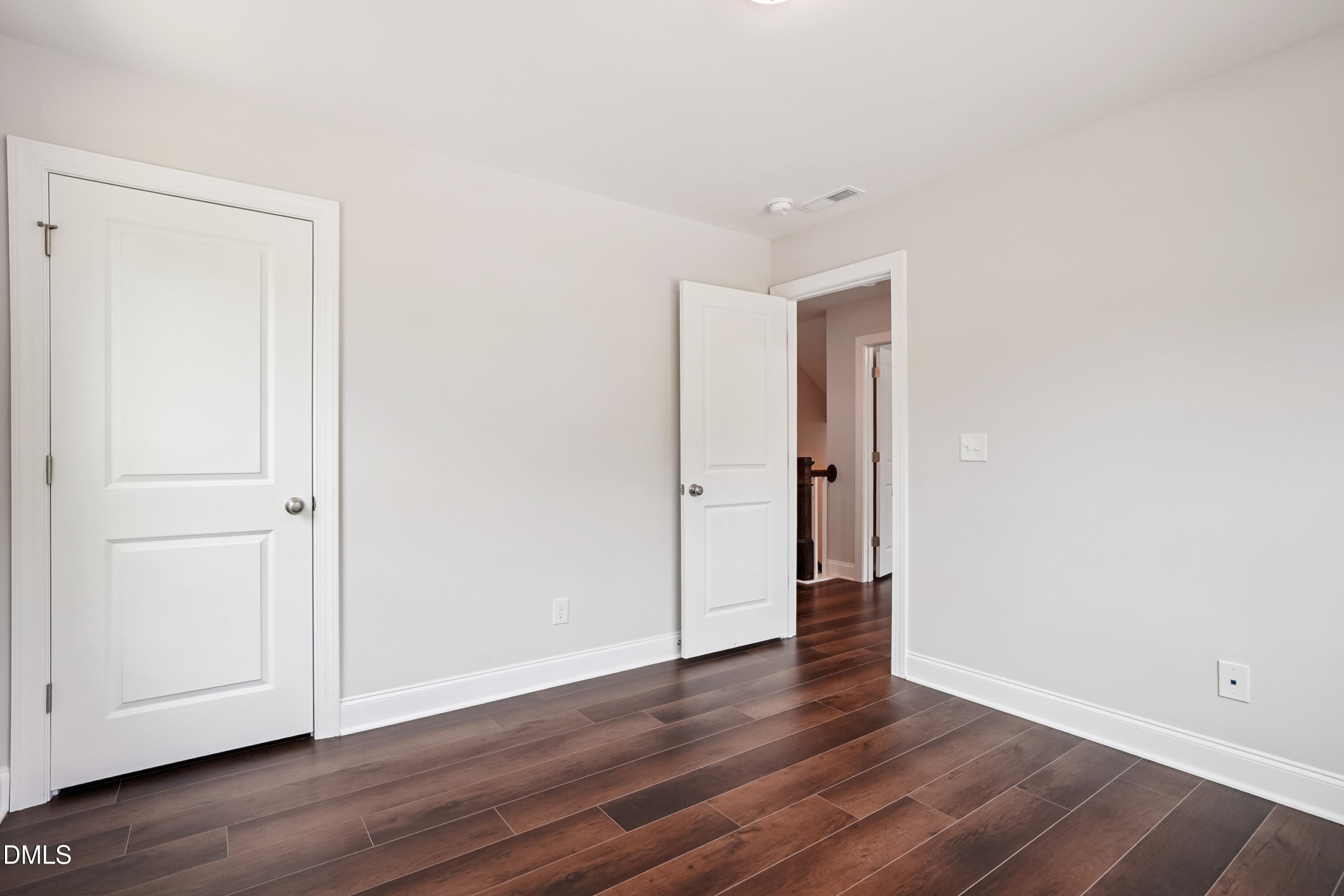 4921 Theater Way Raleigh, NC 27604 - Photo 12 of 26 a view of an empty room with wooden floor