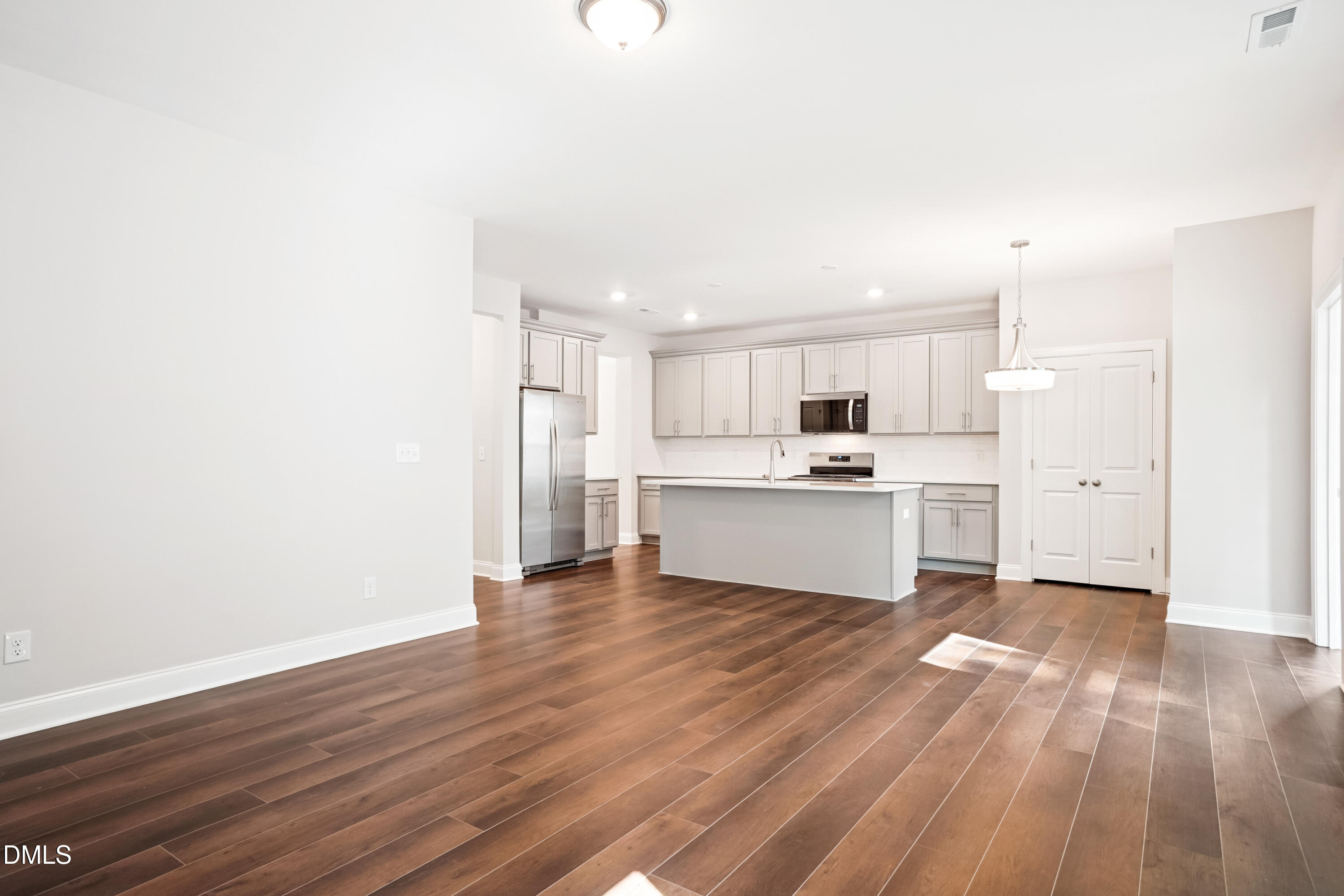 4921 Theater Way Raleigh, NC 27604 - Photo 19 of 26 a view of kitchen with wooden floor