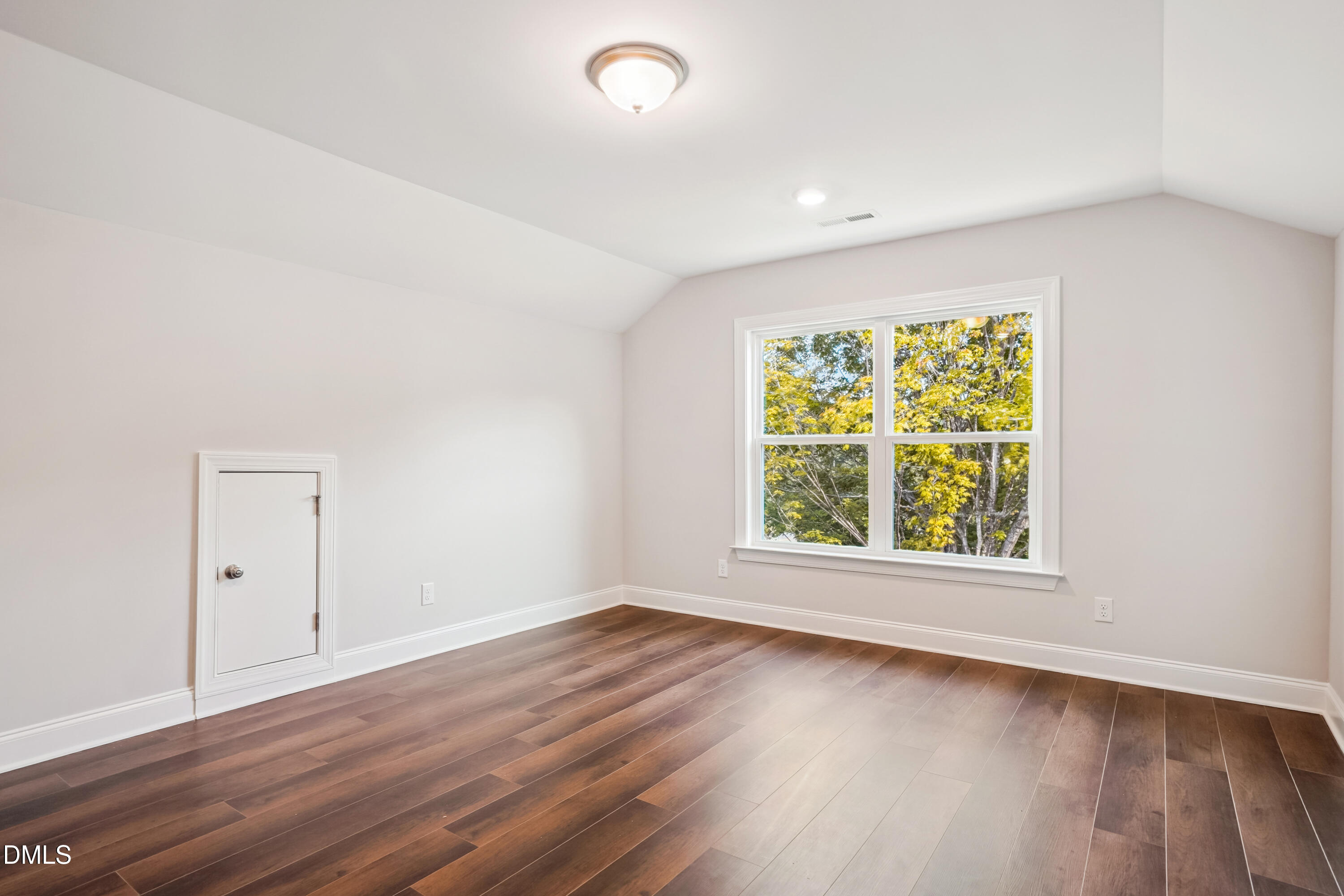 4921 Theater Way Raleigh, NC 27604 - Photo 20 of 26 an empty room with wooden floor and windows
