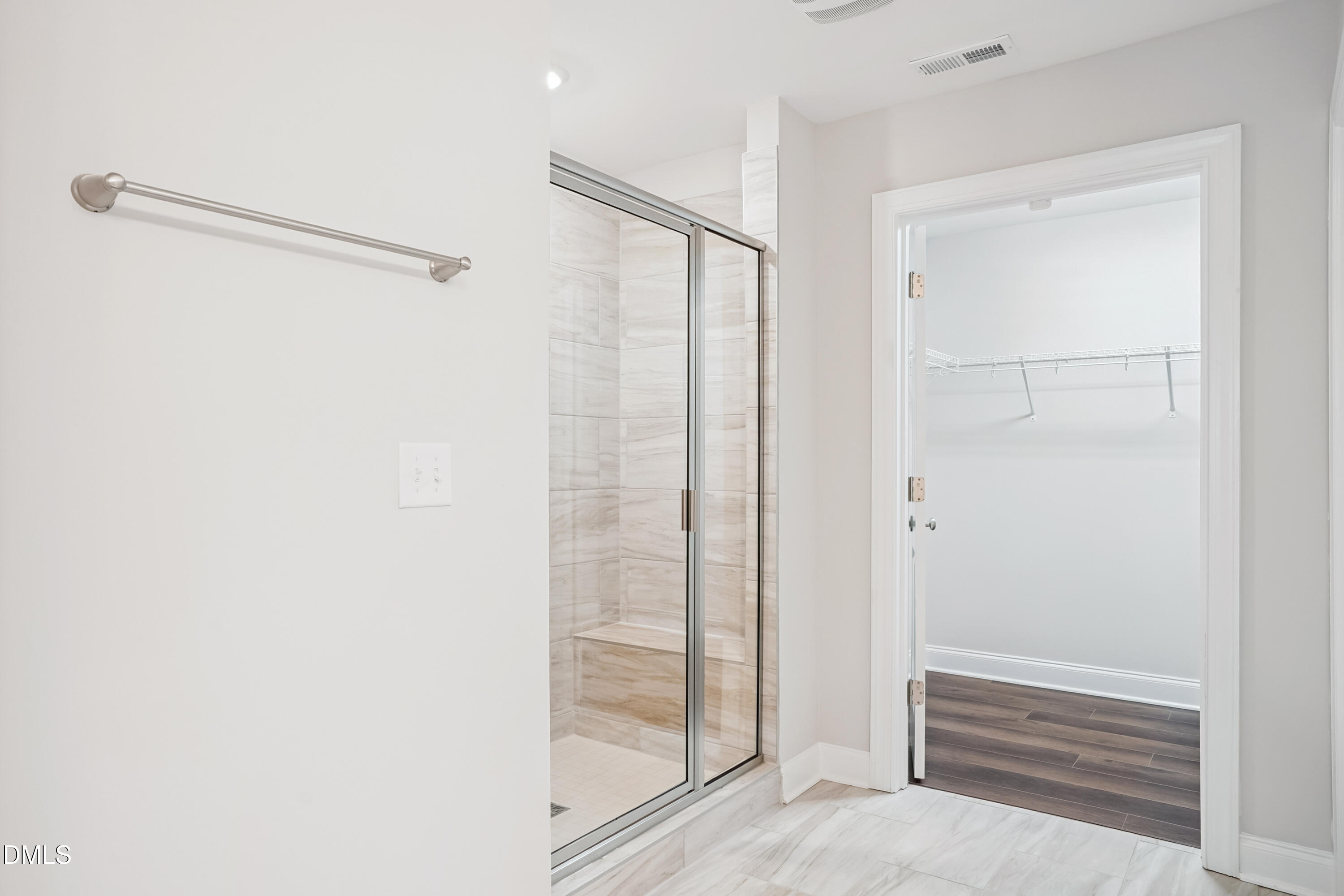 4921 Theater Way Raleigh, NC 27604 - Photo 22 of 26 a bathroom with a glass shower door